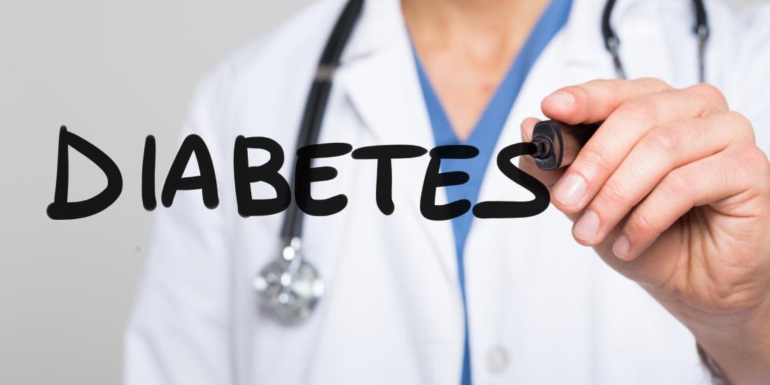 a doctor writing the word diabetes